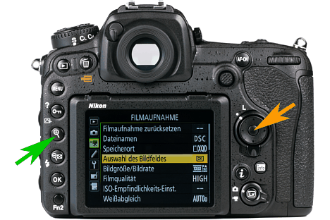 Bild Mit der Mitteltaste des Steuerkreuzes (oranger Pfeil) wird der Fokuspunkt bei der Nikon D5 und D500 im Live-View auf die Mitte gelegt. Mit der Lupentaste (grüner Pfeil) kann dieser Bereich zur visuellen Fokuskontrolle vergrößert werden. [Foto: MediaNord]