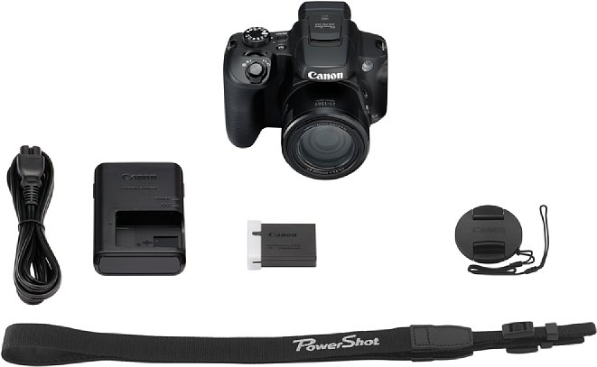 Bild Die Canon PowerShot SX70 HS kommt noch mit einem klassischen externen Ladegerät im Lieferumfang. Aich ein Schultergurt sowie ein Objektivdeckel sind dabei. [Foto: Canon]